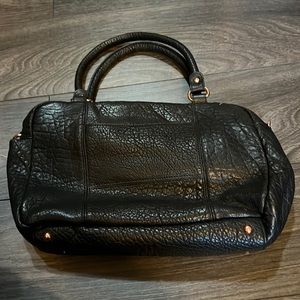Black bubble leather, cross body with rose gold accents satchel option bag.